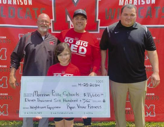 Former Morrison student Ryan Vivar, seen above with his daughter and school representatives, presented a check for $11,600.