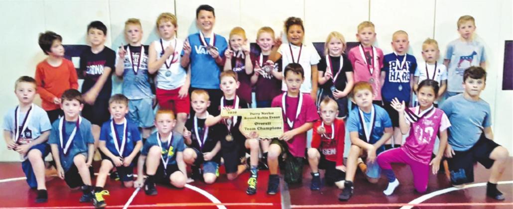 Perry Youth Wrestlers are seen above with the Overall Team Champion Plaque.