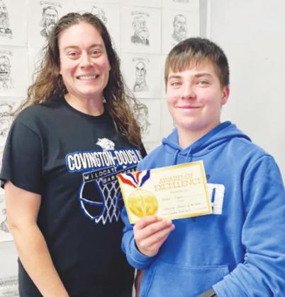 December Student of the month for Covington-Douglas Junior High, Braden Thayer is pictured above at right with nominating educator Ashley Rink.