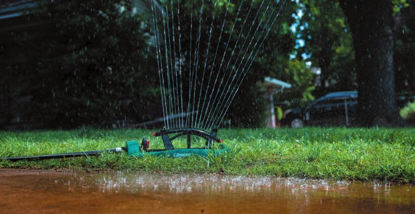 Make sure sprinklers are positioned properly in the landscape to avoid watering the driveway or sidewalk. (Photo by Todd Johnson, OSU Agricultural Communications Services)