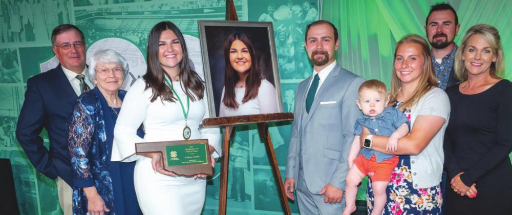 Lincoln County 4-H’er Lilyana Sestak was inducted into the Oklahoma 4-H Hall of Fame at the 100th State 4-H Roundup. She is pictured with her family, from left, Ross Sestak, Valdene Sestak, Jacob Sestak, Hudson Sestak, Amanda Sestak, Jarrod Sestak and Krista Ray. (Photo by Todd Johnson, OSU Agricultural Communications Services)