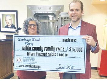 Exchange Bank donates $15,000 to help kickstart the Y’s Annual Campaign. Above, Shea Boschee, Noble County Family YMCA CEO is seen at left with Zack Hall, CEO and President of Exchange Bank.