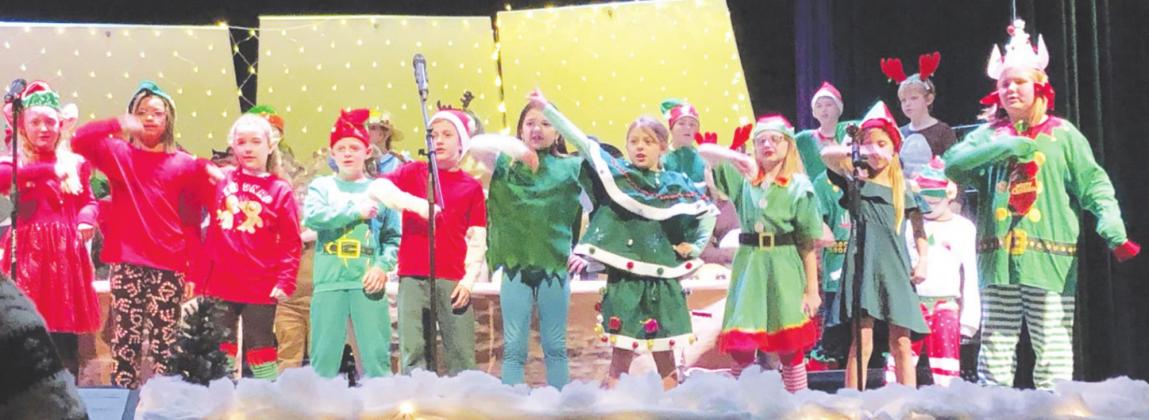 PPS teacher Kelly Frazier recently driected the PPS fourth graders through their musical program ‘Santa’s Holiday Hoedown’. More photos on page 6B.