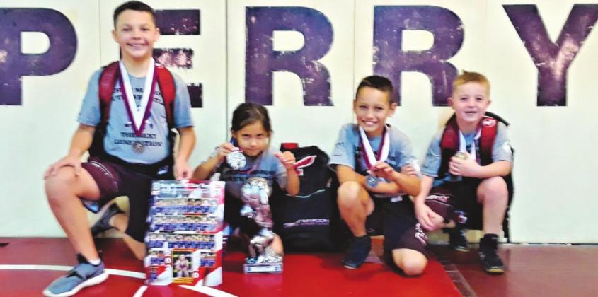Above are the Jackson Four who went on to wrestle in the World of Wrestling Kickoff Classic in Tulsa Nov. 20. From left are Caleb Jackson 12U 96#, Brooklyn Jackson G7U 45# ( Runner Up - 2nd Girls National All Star Team ), Isaac Jackson 10U 64#, and Danny Brake 8U 61#.