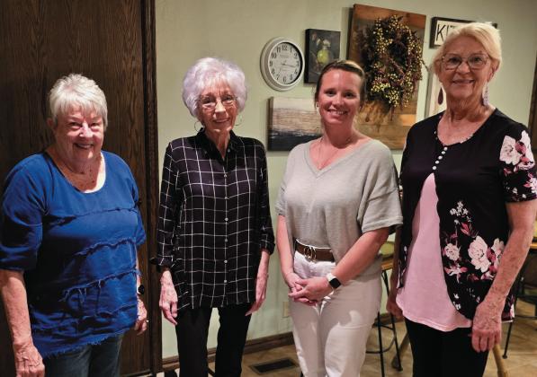 Karen Wilcox, left, was program chair at a meeting April 17, at the home of Bonneta Hansing, second from left. Also pictured are, continuing from left, Connie Smith, a guest, and Linda Luthye, president. Photo by Brenda Vollmer.