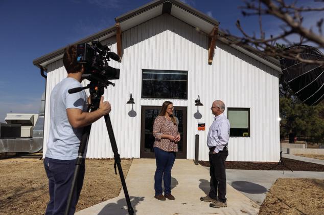 Casey Hentges, host of “Oklahoma Gardening,” talks with Lou Anella, director of The Botanic Garden at Oklahoma State University, as preparations are made for the start of the new season on Feb. 10. (Photo by Mitchell Alcala, OSU Agriculture)