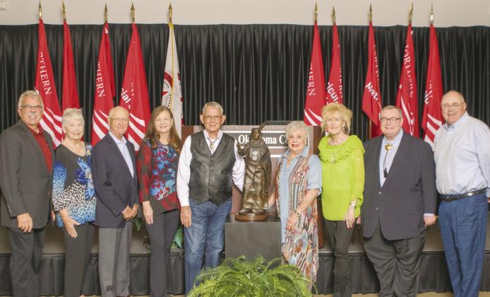 NOC received a bronze statue for their leadership and support of the Standing Bear Program. Pictured (L-R): President Clark Harris, Judy Poole, President Emeritus Tom Poole, President Emeritus Dr. Cheryl Evans, Carl Renfro, Brenda Renfro, Melinda Johnson, Chancellor Emeritus Glen D. Johnson, Tom Evans. Not Pictured: President Emeritus Dr. Joe Kinzer. (photo by John Pickard/Northern Oklahoma College)