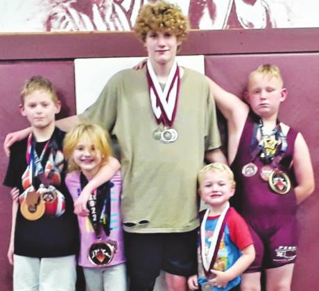 Perry Youth Wrestlers are seen above with their recently earned medals. Pictured from left are wrestlers Kyson Rucker, Alexus Dunagan G7U 50# State Qualifier, Colton Pearson 15U 126# State Qualifier, Johnathan Gillinger, and Kieren Postier 8U Hwt State Qualifier. Not pictured is Isander Woodruff 15U 112# State Qualifier. Coach Don Huff said, “I was so proud that they all again wrestled their toughest and best without vapor locking due to the big setting.