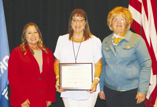 Noble County Deputy Clerk Sheila Zerr is congratulated after receiving her certificate for attaining Basic Certification for County Clerks from the OSU County Training Program (CTP) by SA&amp;I County Management Service Cheryl Wilson and SA&amp;I Public Audits Nancy Grantham.