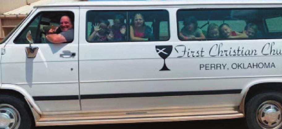 Above, Rev. Josh Bell driving the kids from Perry First Christian Church to the Y for their Safety Around Water class.