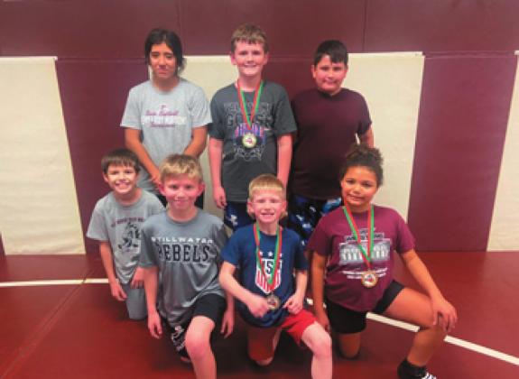 Moore Perry Wrestling Academy wrestlers are, from left, Alexi Valencia, Jett Kennedy, Matthew Stone (bottom row): Jonathan Ruff, Maddox O’Dell and Kendalynn Wilde