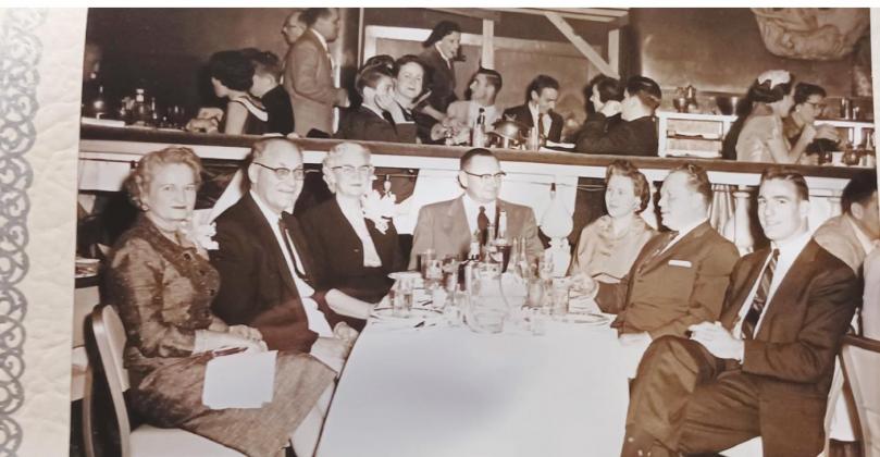 Photograph of oilfield workers and their wives at an Oilfield Banquet.