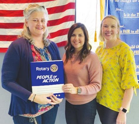Above, Tina Kilmer, commander of American Legion Post 53, was inducted as new member of Perry’s Rotary club. Kilmer, right, is pictured with Melanie McGuire, center, and April Bond, left. At right is Brad Finley. He was guest speaker.